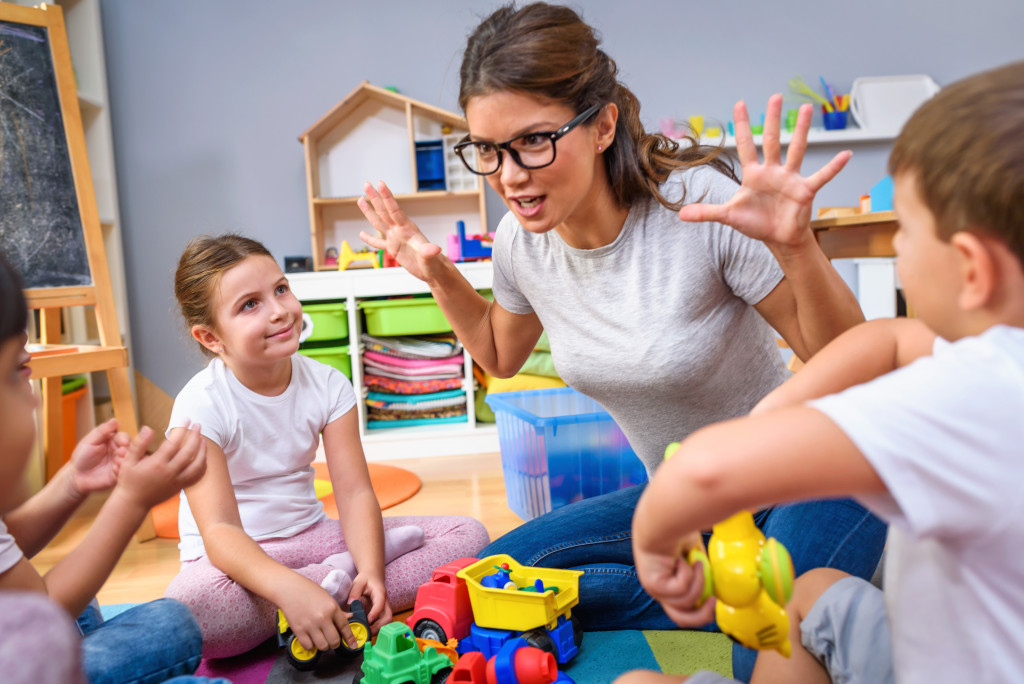 teacher playing with kids