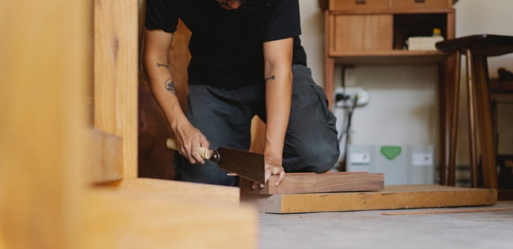 man working as carpenter