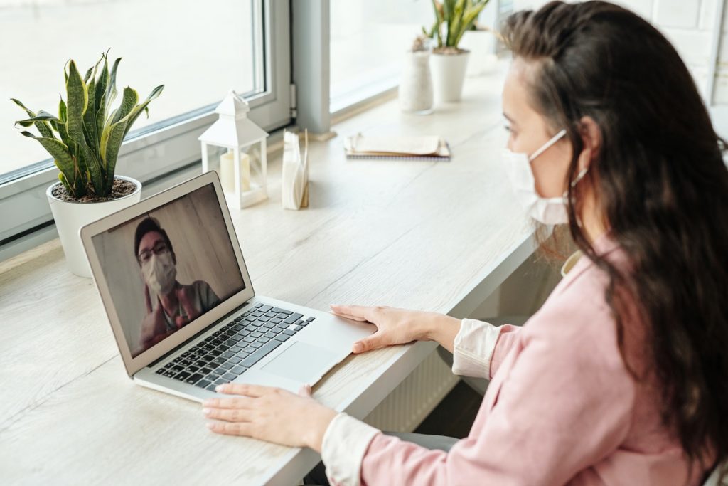 isolated woman doing a video conference